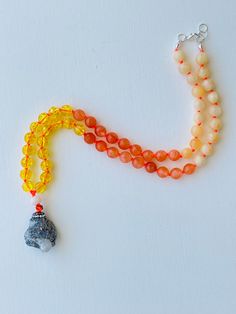 I am motivated to pursue my true purpose. I am comfortable with my power. I am ambitious and capable of whatever I desire. My solar plexus chakra is balanced. This purchase includes: Gemstone Mala, baggie, box, card including using your mala, intention setting and properties. GEMSTONES Calcite: As a strong solar plexus chakra stone, Yellow Calcite is amazing when it comes to helping you in transitory periods of life. It builds up self-esteem and a positive attitude ensuring you can shine. Orange Amber Crystal Necklace For Meditation With Natural Stones, Natural Stones Pendant Crystal Necklace For Meditation, Natural Stone Pendant Crystal Necklace For Meditation, Spiritual Amber Necklace For Healing, Crystal Pendant Necklace With Natural Stones For Meditation, Bohemian Amber Crystal Necklace For Meditation, Spiritual Adjustable Hand-strung Crystal Necklaces, Spiritual Agate Crystal Necklaces For Healing, Meditation Necklace With Natural Stones And Mineral Crystal