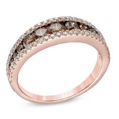 a rose gold ring with brown and white diamonds