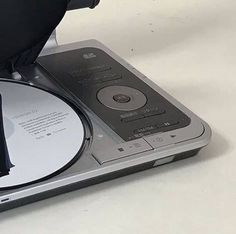 an open cd player with a black case