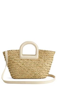 Bring a coastal element to any look with this basket bag that's woven from seagrass straw plaited in a chevron pattern. The summery piece is accompanied by a slim leather strap for carrying versatility. Push-pin tab closure Top carry handles; removable, adjustable crossbody strap Unlined Seagrass straw with leather trim Imported Handwoven Bag, Mini Bucket, Woman Bags Handbags, Basket Bag, Plaits, Chevron Pattern, Push Pin, Crossbody Strap, Leather Trim