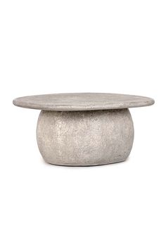 a concrete table with a circular top on it's side, in front of a white background