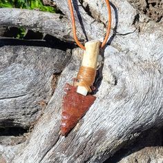 This beautiful Native American style necklace features an obsidian arrowhead flintknapped by artist Mike Simpson. The obsidian is from Glass Buttes, Oregon. The arrowhead is hafted to white tail deer antler using modern waterproof materials. it is wrapped with artificial sinew. the cord is genuine leather and features adjustable sliding knots. one size fits most. Approximate cord length is between 26 inches long and 16 inches long. pendant measures 3 1/8 inches by 1 inch. Bohemian Brown Arrowhead Jewelry, Bohemian Brown Arrowhead Necklace, Brown Arrowhead Necklace For Gift, Unique Handmade Arrowhead Necklaces, Unique Handmade Arrowhead Necklace, Rustic Arrowhead Necklace For Gift, Rustic Handmade Arrowhead Necklace, White Tail Deer, Obsidian Arrowhead