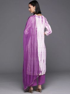 Grab this beautiful 3-piece set. The set comes with leheriya print kurta has round neck, 3/4th sleeves & calf length teamed with solid palazzo pants with semi elasticated waistband & drawstring closure and a silk chiffon dupatta with tapping border. Color - Purple & White Kurta Fabric-Cotton Bottom Fabric - Cotton Dupatta Fabric - Silk Chiffon Neck-Round Neck Sleeves-3/4th Sleeves Work - Leheriya Print Detailing Washing Instructions-Machine Wash DISCLAIMER - The color of the product may be diffe Kids Kaftan, Casual Abaya, Modest Evening Dress, White Kurta, Cotton Dupatta, Moroccan Caftan, Chiffon Dupatta, Cotton Bottoms, Pinocchio