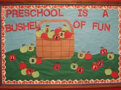 a bulletin board with apples in a basket and words preschool is a bushel of fun