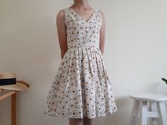 "Cream Floral Print Dress - Canvas fabric - Invisible nylon zipper on the back - Fixed waist - Fully lined - Pleated skirt - Ready to ship in 1-3 business days Measurements : Bust : 34\" Waist : 26\" Hips : free Total length : 35.5\" Shoulder to waist : 14.5\" Model height : 5'6\" bust : 33\" waist : 25\" hips : 35\" Please read the policies tab before purchase. I can't have a model for clothes of all sizes, but I have already clearly written a model size. If you have questions about the size, p Cotton V-neck Lined Sundress, Fitted A-line Cotton Sundress, Cotton A-line Sundress Sleeveless, Sleeveless Lined Cotton Dress, Fitted Cotton Knee-length Sundress, Fitted Knee-length Cotton Sundress, Casual Cotton Sleeveless Lined Dress, Knee-length Cotton Dress With French Seams, Cotton V-neck Sleeveless Sundress