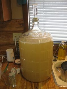 a large jug sitting on top of a wooden counter