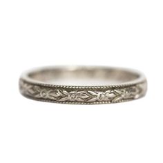 an antique style wedding ring with filigrees