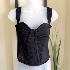 Brand New Never Worn. Very Sexy Top, You Can Wear It With Jeans Or As A Lingerie Top. Black Underwire Corset With Built-in Bra, Flirty Corset With Built-in Bra For Night Out, Black Party Corset With Built-in Bra, Black Underbust Corset With Removable Bra Pads, Black Stretch Corset With Straps, Black Fitted Underwire Corset, Underwire Nylon Corset For Parties, Party Underwire Nylon Corset, Sleeveless Black Nylon Corset