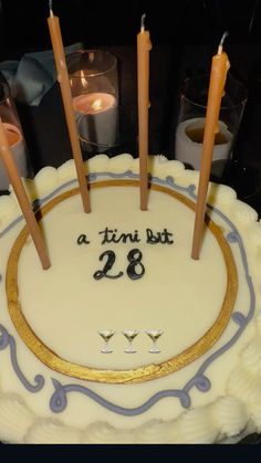 a birthday cake with candles in the middle