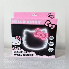 the hello kitty light up wall decor is in its box with instructions to make it glow