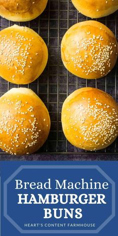 bread machine hamburger buns on a cooling rack with sesame seeds in the middle and text overlay that reads, bread machine hamburger buns