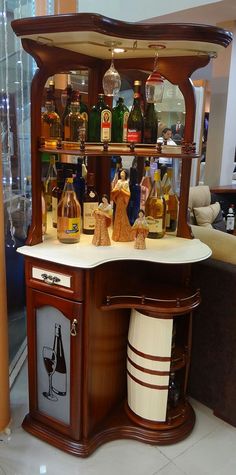 an old fashioned liquor cabinet with many bottles