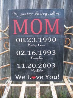 a sign that says mom on it sitting in front of a fence with the words, my greatest blessing call me