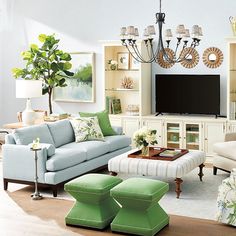 a living room filled with furniture and a flat screen tv