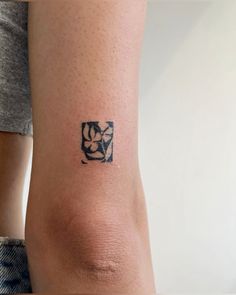 a person with a small tattoo on their arm