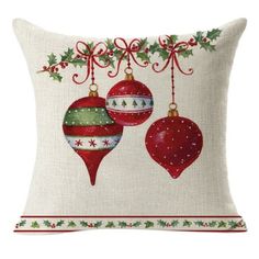 a pillow with christmas ornaments hanging from it