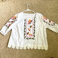 White, Embroidered Peasant Blouse, Never Worn. Pit-Pit 20”, Length From Shoulder 21”, Sleeve From Shoulder 13”. Peasant Floral Embroidered Top For Beach, Peasant Style Embroidered Top For Vacation, Folk Style Peasant Tunic Top With Floral Embroidery, Folk Style Peasant Top With Floral Embroidery, Spring Embroidered Hem Tunic Top, Spring Vacation Blouse With Embroidered Hem, Spring Tunic Blouse With Embroidered Hem, Peasant Blouse With Floral Embroidery For Vacation, White Floral Print Tunic Top