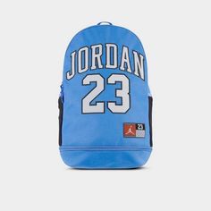 Large zippered main compartment.Internal laptop sleeve.Front zip pocket with organizer.Side bottle pockets.Padded back panel.Adjustable shoulder straps.Zippered shoe garage.19.5” H x 12.25” L x 7” D.27L capacity.100% polyester.The Jordan Jersey Backpack is imported..Take all of your essentials with you in a bag designed to look like Michael Jordan's basketball jersey with the Jordan Jersey Backpack. It has a large main compartment and a shoe garage so you can keep them separate from the rest of Blue Bags With Ykk Zipper For Outdoor Activities, Back To School Standard Backpack With Logo Patch, Daily Use Backpack With Logo Patch, Sports Bags With Zipper Closure, Sporty Backpack With Logo Patch, Back To School Travel Bags With Logo Patch, Standard School Backpack With Logo Patch, Casual Blue Bag With Logo Patch, Casual Blue Bags With Logo Patch