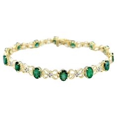 This elegant 14 karat gold tennis bracelet is a breathtaking testament to the timeless allure of emeralds and diamonds. The bracelet's design is a harmonious interplay of vibrant oval emeralds, each exuding a lush green hue, and infinity loop motifs that add a touch of continuity and sophistication. The brilliance of the emeralds is further accentuated by the captivating presence of white diamonds, nestled at the heart of each loop in a setting of contrasting white gold. Crafted with meticulous attention to detail, the bracelet not only showcases the rich color of the emeralds but also emphasizes the dazzling sparkle of the diamonds through the strategic use of white gold. The result is a piece that seamlessly marries classic gemstones with a contemporary design, creating a timeless access Elegant Yellow Gold Emerald Tennis Bracelet, Elegant Yellow Gold Bracelet With Emerald, Elegant Yellow Gold Diamond And Emerald Bracelet, Elegant Diamond And Emerald Bracelet With 17 Jewels, Elegant Gold Emerald Tennis Bracelet, Elegant Emerald Diamond Bracelet For Formal Occasions, Elegant Green Oval Diamond Bracelet, Elegant Formal Emerald Diamond Bracelet, Elegant Green Diamond Bracelet With Prong Setting