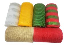 four rolls of colored mesh on white background