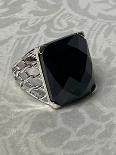 Very Lovely!! Sterling Silver 925, Checkerboard Emerald Cut Black Onyx Statement Ring Size- 9  Weight : 8.7 grams  Sterling silver Main Stone: Emerald Checker Board Cut Genuine Black Onyx, 20 mm x 15 mm Shank Width: 3.0 mm wide Dimensions: 21 mm wide x 20 mm long x 8 mm high Thank you for Visiting! Black Onyx Jewelry With Large Stone, Elegant Black Jewelry With Large Stone, Black Faceted Rings For Formal Occasions, Formal Black Jewelry With Large Stone, Silver Faceted Onyx Jewelry, Checker Board, Silver Gift Wrap, Cool Necklaces, Silver Gifts