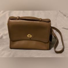 Rare Vtg Nwt Coach “Court” Leather Handbag, “Taupe,” W/Adjustable Strap ***Personally Purchased 10/12/1996, At Coach Warehouse Sale, Reading, Pa, But Never Used It. This Is Not Refurbished! Fs Marking Indicates “Factory Sale/Final Sale” (As Was Told Day Of Purchase). Features Authentic, Genuine Coach Brand “Court” (Style No. 9870) “Taupe” Cross Body Bag Glove-Tanned Leather Unlined Suede Interior Inside Zipper Pocket Front & Back Open Pockets Foldover Flap W/Turnlock Closure Coach Hangtag On Cha Classic Tote Flap Bag For Travel, Vintage Brown Flap Bag, Vintage Coach Travel Bags, Vintage Brown Flap Bag For Travel, Vintage Crossbody Bag With Gold-tone Hardware, Coach Formal Flap Satchel, Coach Flap Satchel For Formal Occasions, Classic Flap Bag With Detachable Handle, Classic Coach Shoulder Bag For Formal Occasions