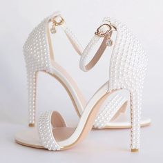 Category:Wedding Shoes; Embellishment:Pearl; Season:Summer; Heel Type:Stiletto Heel; Gender:Women's; Toe Shape:Open Toe; Type:Bridal Shoes,Wedding Sandals; Style:Elegant,Classic; Heel Height(inch):4-5; Outsole Materials:Rubber; Occasion:Wedding,Party; Closure Type:Ankle Strap; Pattern:Solid Colored; Shipping Weight:0.55; Production mode:Self-produce; 2022 Trends:Ankle Strap Sandals; Foot Length:; Size chart date source:Provided by Supplier. Bride Heels, Wedding Shoes Pumps, Elegant Wedding Shoes, Wedding Pumps, Bridal Heels, Strappy High Heels, Wedding Shoes Heels, Bling Shoes, Bridesmaid Shoes