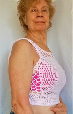 Wear this pink handmade pink crop top with pride.  I have many colors for this fishnet tank top available and it is customizable.  Message me for details. Available in light blue, light pink, light yellow and pure white or black. The model is 5 feet 6 inches tall with a size 36 inch bust.  She is wearing a size M. This cottagecore y2k shirt will brighten your days as spring approaches. These boho  tank tops become softer with each washing.  They are 100% acrylic. I wash them inside out in a pill Cottagecore Y2k, Cottagecore Shirt, Boho Tank Top, Style Cottage, Pink Crop Top, Cropped Tops, Top Tank, Cropped Tank Top, Handmade Crochet