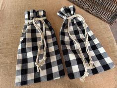 two black and white checkered bags tied together