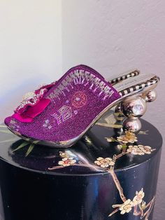 "Embroidered & beaded silken mules in varying shades of purple with crystal embellished raspberry colored ribbon rosettes, slightly flared upper, stacked bubble detail mirrored gold acrylic 4\" heels with large inset acrylic rhinestone. Ribbed rubber outsole prevents slips.  Marked a size 11, but actual fit is for a size 9.5M (please see measurements for accurate sizing). Gently used condition with some scuffs to gold finish in some places on lower footbed side of heel (see closeup);  a couple r Ribbon Rosettes, Clogs And Mules, Raspberry Color, Clogs Shoes, Shades Of Purple, Gold Finish, Heeled Mules, Raspberry, Violet