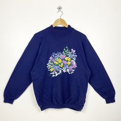 90s Morning Sun Flowers Crewneck Sweatshirt Print Logo Blue Color Women's L - Made in Usa - Materials : Cotton, Polyester  - Tag Reads : Women's L Kindly see the actual measurements (All measurements were taken lying flat) - Actual size manual measurements * Width (Armpit to armpit) : 23 inches * Length (Shoulder to end of garment) : 26 inches * Sleeve length : 24 inches - Condition : * Vintage condition 9/10 (90%) * Free from any tear and major defect - Shipping : * DHL EXPRESS = 3-6 business day arrived * Please PROVIDE your PHONE/CONTACT NUMBER for SHIPPING/DELIVERY purpose Vintage Blue T-shirt For Fall, Blue 90s Style Tops For Fall, 90s Blue Cotton Sweater, 90s Style Blue Cotton Sweater, Vintage Blue Sweatshirt For Spring, Sweatshirt Print, Sun Flowers, Womens Sweatshirts, Morning Sun