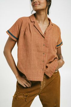 Crafted from pure breathable yarn-dyed cotton fabric, this lightweight shirt is tailored for a relaxed fit and features a pointed collar neck with a front patch pocket, a relaxed long sleeve, and a stepped hem for a laidback silhouette. Style this shirt with matching straight-cut trousers or a pair of jeans for office hours or semi-formal gatherings. Closed neckline Front button placket Long cuffed sleeves Coconut buttons Length: 22 inches Made with 100% handwoven cotton "Every style has a diffe Casual Shirt With Colorful Pattern, Chekered T Shirt, Vintage Style Cotton Shirt, Casual Dress Shirt With Pockets, Vintage Shirt With Relaxed Fit, Handwoven Fabric, Collar Neck, Checkered Shirt, Summer 24