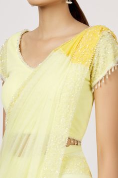 Lemon pre-stitched saree with sequins embroidered border. Paired with tassel blouse.
Component: 2
Embroidered
Neckine: V neck
Sleeve Length: Short
Fabric: Tulle
Color: Yellow
Sequins border - Aza Fashions Festive Yellow Pre-draped Saree, Yellow Pre-draped Saree With Unstitched Blouse, Yellow Pre-draped Saree With Mirror Work, Yellow Pre-draped Saree With Cutdana, Fitted Yellow Embroidered Pre-draped Saree, Tassel Blouse, Stitched Saree, Drape Saree, Embroidered Border