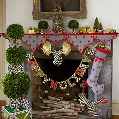 a fireplace decorated for christmas with stockings and stocking