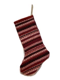 a red and black striped sock hanging from a string