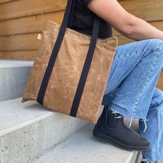 "This waxed canvas tote bag will hold a 13 inch laptop and a bunch more. Like all my bags, it is vegan. There's an exterior pocket that will fit your phone, and 3 interior slip pockets for all your essentials. The exterior is made of 13 oz waxed cotton canvas.  Waxed Canvas acts as a natural water repellent, so you'll love having it by your side rain or shine.  Waxed canvas has a worn and rustic appearance and texture.  It is normal for it to look like it has scratches and creases.  Bag Details Outdoor Canvas Tote Bag With Zipper Closure, Rectangular Canvas Bag With Zipper Pocket For Outdoor Activities, Practical Rectangular Canvas Bag With Waxed Finish, Practical Waxed Canvas Bag, Eco-friendly Everyday Waxed Canvas Bag, Practical Rectangular Waxed Canvas Bag, Eco-friendly Waxed Canvas Bag With Canvas Lining, Eco-friendly Waxed Canvas Travel Bag, Cotton Bag With Waxed Finish For Outdoor Activities