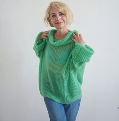 Hello, I'm the one, who won't let you down - green loose sweater. I will comfort you, keep you warm and will make you smile. I'm 100% hand made and proud of that. I consist of 70% knit mohair and 30% of nylon, which makes me incredibly natural. I'm quite unique as could be worn all year long. I'm in one size and one size fits all because my measurements are : ❤️ Width -67 cm ❤️ Lengths -60 cm If you would like me in other size, you could request a custom order with your own parameters, so do not Trendy Green Acrylic Sweater, Trendy Green One-size Sweater, Trendy Green Chunky Knit Sweater, Trendy Green Turtleneck Sweater, Green Soft Knit Turtleneck Sweater, Winter Green Oversized Sweater, Green Chunky Knit Sweater For Winter, Oversized Green Sweater For Winter, Oversized Green Turtleneck Sweater