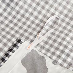 a piece of clothing with a white and black checkered pattern on it