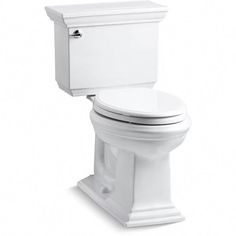 a white toilet sitting on top of a white floor