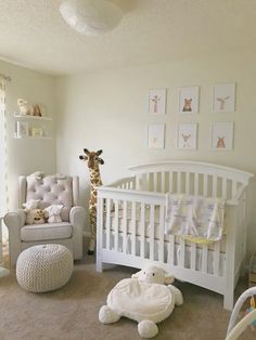 a baby's room with a crib, rocking chair and giraffe pictures on the wall