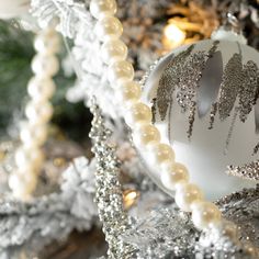 Add a bit of luxury to your decor with this pearl beaded garland. Perfect for accenting any tree or banister, this garland will make a great final touch to any Holiday decor. Over the last 55 years, Sullivans has become an industry leader in home decorations. Our brand is rooted in tradition while incorporating modernized trends to keep your home looking up to date with timeless style. Here at Sullivans, we pride ourselves on creating product designs focused on quality and value, ensuring that o Pearl Garland Christmas Tree, Pearl Garland Christmas, White Christmas Garland, Pearl Christmas, Pearl Garland, 55th Anniversary, Icicle Ornaments, Final Touch, Beaded Garland