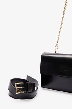 Handcrafted from Italian spazzolato leather, our Megan Convertible Purse is your day-to-evening dream. With her two removable straps, you can wear her four ways: as a clutch, a crossbody, a shoulder bag, or a belt bag. For day, wear Megan as a crossbody or a belt bag using her black leather strap. Come evening, attach the metal chain crossbody strap and Megan is ready to party—or go strapless and carry Megan as a clutch. Megan's magnetic fastening and gold-tone metalwork are the finishing touche Sleek Evening Shoulder Bag With Detachable Strap, Elegant Rectangular Bag With Removable Belt, Luxury Formal Shoulder Bag With Removable Belt, Modern Formal Shoulder Bag With Removable Belt, Elegant Shoulder Bag With Removable Belt For Everyday Use, Evening Leather Shoulder Bag With Removable Belt, Chic Shoulder Bag With Removable Belt, Classic Formal Bag With Removable Belt, Classic Formal Bags With Removable Belt