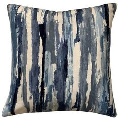 a blue and white striped pillow on a white background with an abstract design in the middle