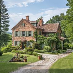 a large brick house surrounded by lush green trees