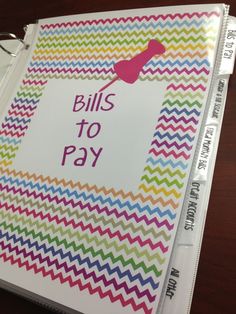 a binder with bills to pay written on it