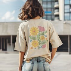 Embrace summer vibes with our boho floral shirt, a charming gift for her! This oversized tee features a retro design with wildflowers and a motivational quote. Perfect for girls who love unique style and comfy fashion statements. Boho & Cottagecore: https://etsy.me/3QnmGud  Yoga Clothes: https://etsy.me/4axsVUp Coffee Mugs: https://etsy.me/4cIpxHM Tote Bags: https://etsy.me/4cTKi3l " An extraordinarily imaginative print, the shirt was delivered very quickly and the recipient is totally happy wit Trendy Floral Print T-shirt For Summer, Custom Print Summer Tops For Everyday, Bohemian Letter Print Summer Tops, Custom Print Summer Top For Everyday, Oversized Floral Print T-shirt For Spring, Custom Print Tops For Everyday Summer Wear, Custom Print Top For Everyday Summer Wear, Spring T-shirt With Custom Print And Relaxed Fit, Bohemian T-shirt For Spring Vacation