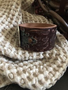 "🔸🔸orders are delayed by a few days this week. Thank you for your patience Country leather bracelet cuff, western jewelry Embossed distressed genuine brown leather 1 1/2\" strap has been adorned with an oval southwestern silver concho which sets on a detailed antiqued copper filigree which has been given a rich patina. It is attached to the leather with two antiqued copper rivets. One antiqued copper snap has been placed to fit up to a 7 1/4\" wrist. I can add another snap if you would like a Cowgirl Bracelets, Chunky Bracelet, Santa Clarita, Chunky Bracelets, Bracelet Leather, Leather Cuffs Bracelet, Bracelet Cuff, Western Jewelry, Dark Brown Leather