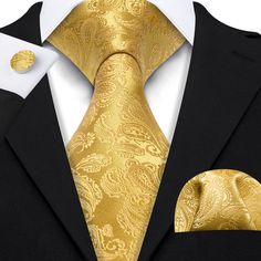 If you're seeking a distinctive touch to elevate your ensemble, explore our Gold Paisley XL Tie Set at Sophgent. The tie is made of high-quality silk, giving it a luxurious feel and ensuring it will hold its shape well. Whether you're attending a wedding, a job interview, or a night out on the town, this tie is sure to make a statement. Add it to your collection today and elevate your style. 100% Silk Handmade Includes: Tie, Pocket Square and Cufflinks Length: 63" Width: 3.34" Warm iron if neede Luxury Ties For Office Suit Accessories, Luxury Tie For Gift, Luxury Standard Tie For Gift, Luxury Gift Tie, Gold Suit And Tie Accessories For Business, Gold Cufflinks For Black Tie Events, Luxury Gold Suit And Tie Accessories For Formal Occasion, Dapper Gold Accessories For Black Tie Suit, Dapper Gold Tie For Business