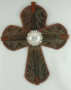 the cross is made out of leather and has a crystal center on it's side