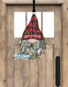 an image of a door with a santa claus hat on it's head and the words merry christmas